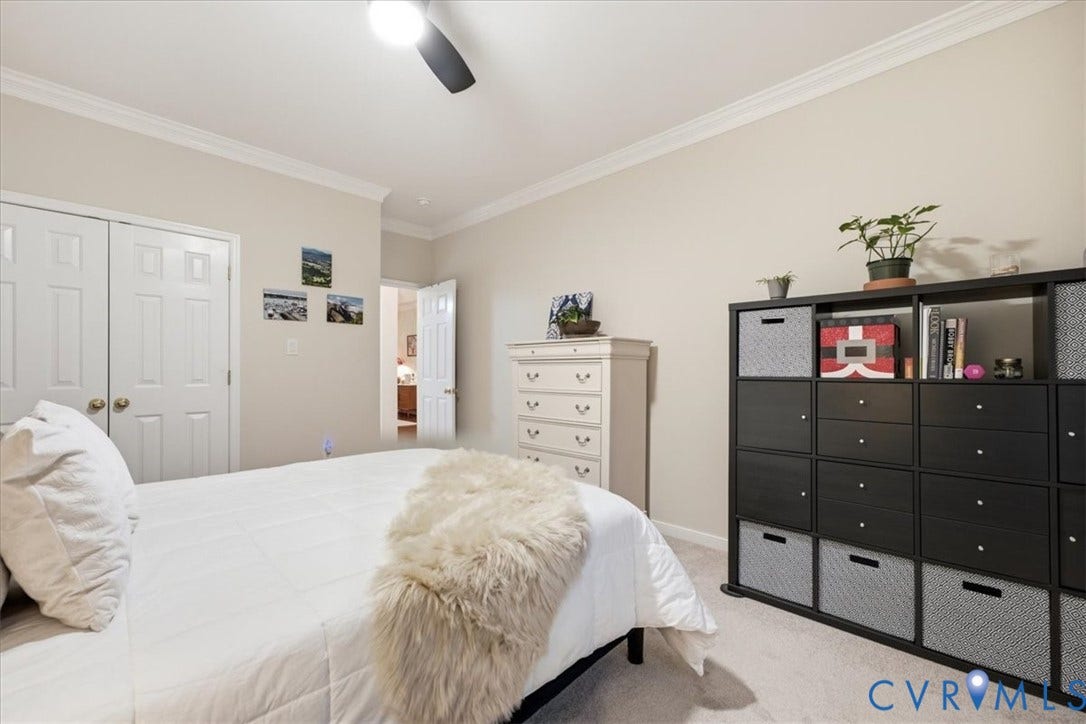 Recessed lighting, crown molding, double bi-fold closet doors, and a ceiling fan