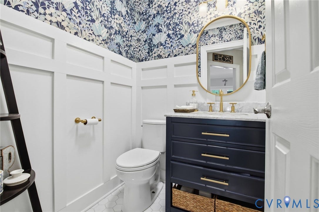 435 Shadow Creek Lane, Manakin Sabot, VA 23103 Bathroom featuring a dark blue vanity with gold hardware, a white countertop, and an oval gold-framed mirror