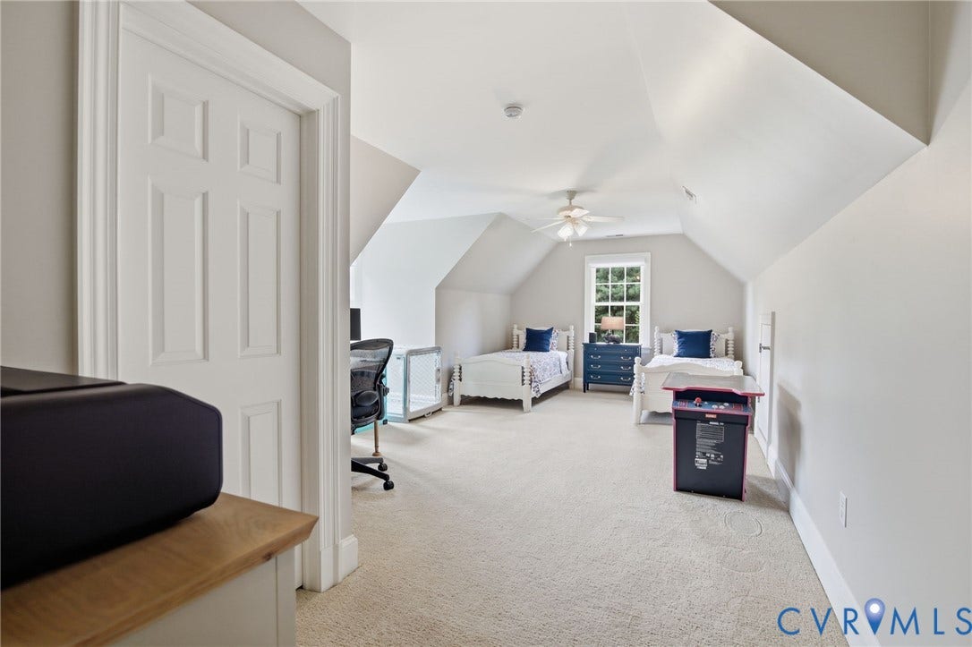 435 Shadow Creek Lane, Manakin Sabot, VA 23103 Carpeted room featuring a white paneled door, sloped ceilings, and a window with white trim