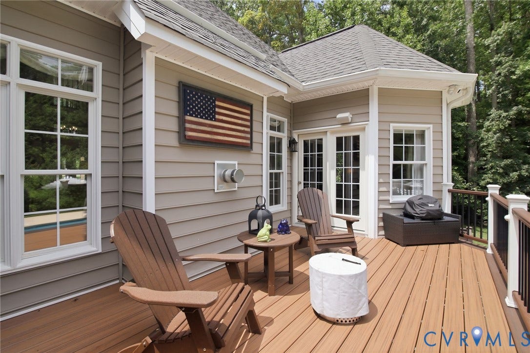 435 Shadow Creek Lane, Manakin Sabot, VA 23103 Expansive outdoor deck featuring wood-finish flooring, white double French doors, and an exterior wall with horizontal siding