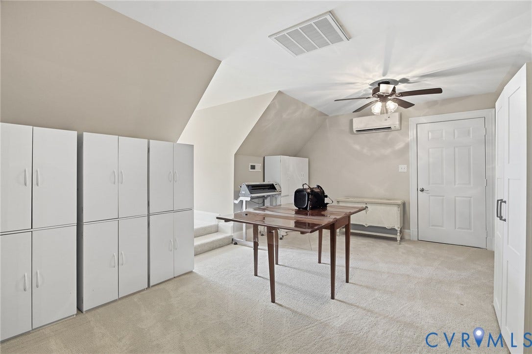 435 Shadow Creek Lane, Manakin Sabot, VA 23103 Attic space featuring extensive built-in white cabinetry, sloped ceilings, recessed lighting, and light-toned carpeting