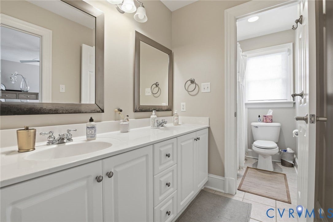 435 Shadow Creek Lane, Manakin Sabot, VA 23103 Double vanity with undermount sinks, white cabinetry, and brushed nickel hardware