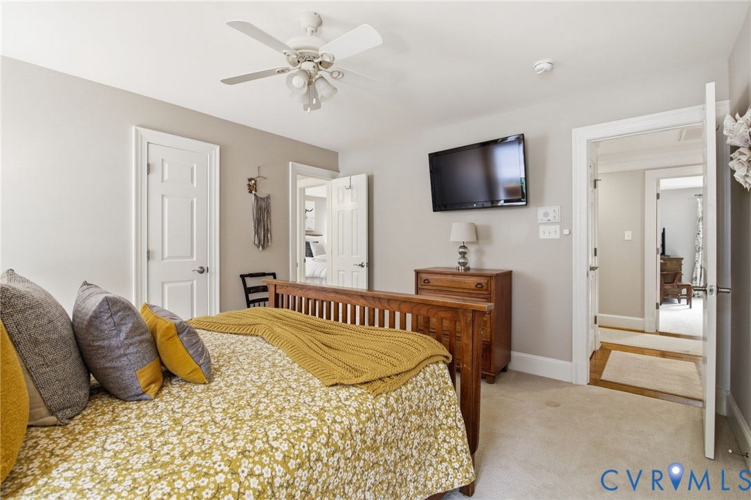 435 Shadow Creek Lane, Manakin Sabot, VA 23103 Carpeted room featuring a ceiling fan with integrated lighting, a wall-mounted television, and white trim molding