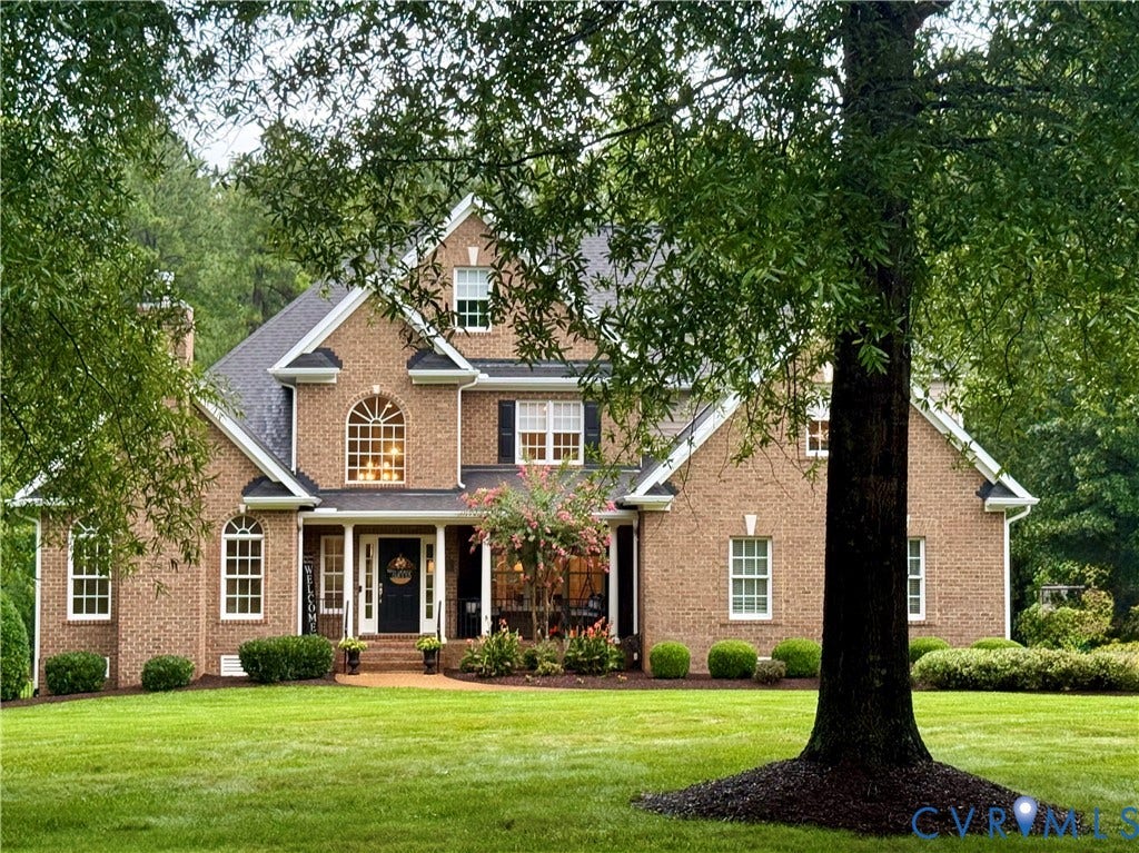 435 Shadow Creek Lane, Manakin Sabot, VA 23103 Traditional brick exterior with multiple gables and a covered front porch
