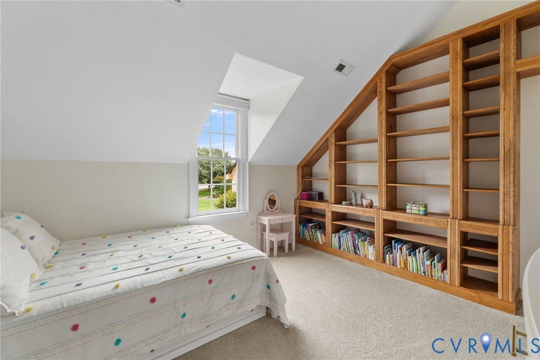 12305 Bradford Landing Way, Wyndham, Glen Allen, VA 23059 Built-in shelving and window seat arrangement with natural wood-finish. Vaulted Ceiling