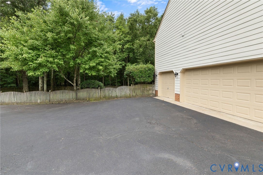 12305 Bradford Landing Way, Wyndham, Glen Allen, VA 23059 3 car side load garage with pedestrian door.