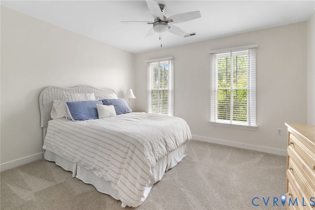 12305 Bradford Landing Way, Wyndham, Glen Allen, VA 23059 Carpeted room with two windows featuring white blinds, a ceiling fan with integrated lighting, and neutral wall tones