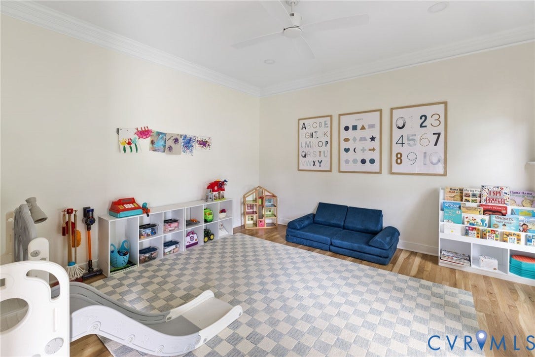 12305 Bradford Landing Way, Wyndham, Glen Allen, VA 23059 Spacious room featuring light wood-finish flooring, recessed lighting and ceiling fan, and crown molding. Used as Kids Playroom - great flex living space