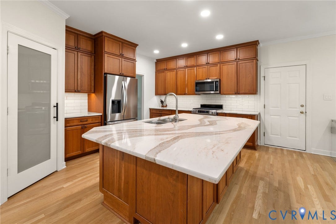 12305 Bradford Landing Way, Wyndham, Glen Allen, VA 23059 walk in pantry in kitchen with built in shelving, kitchen aid appliances