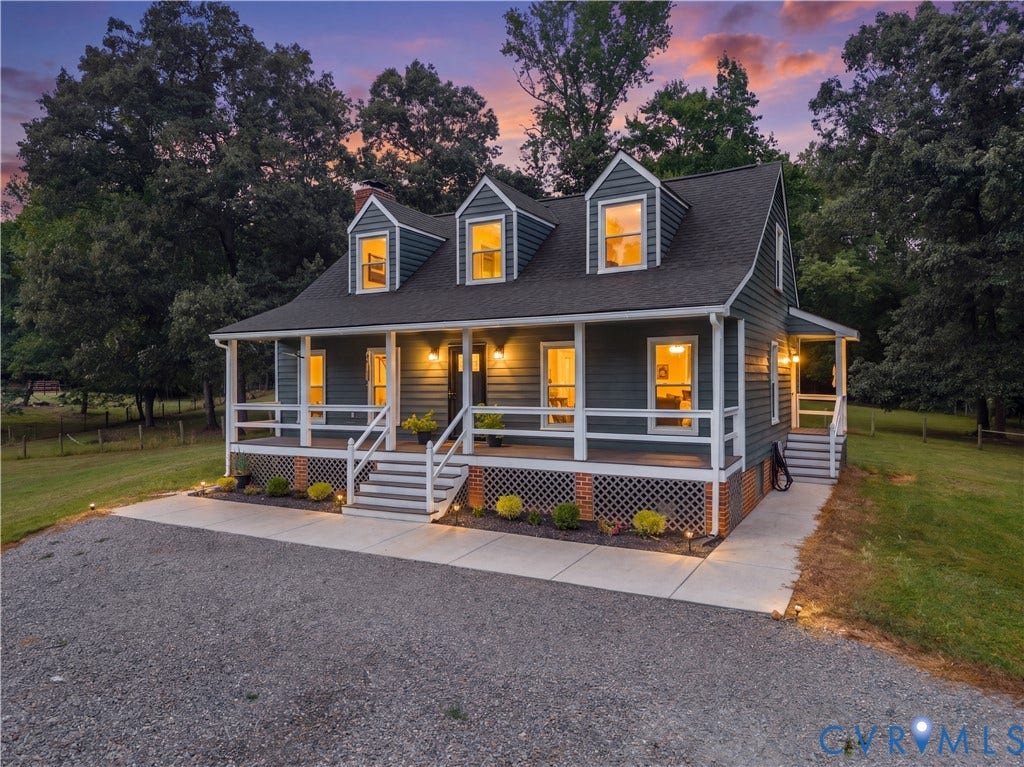 3927 Hughes Creek Road, Powhatan, VA 23139 Siding exterior with three dormer windows and a covered front porch featuring white railings