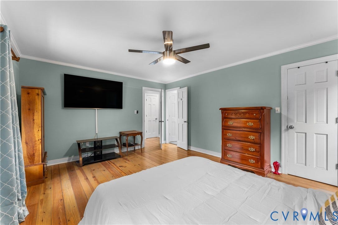 3927 Hughes Creek Road, Powhatan, VA 23139 Wood-finish flooring, ceiling fan with integrated lighting, multiple paneled doors, and painted walls