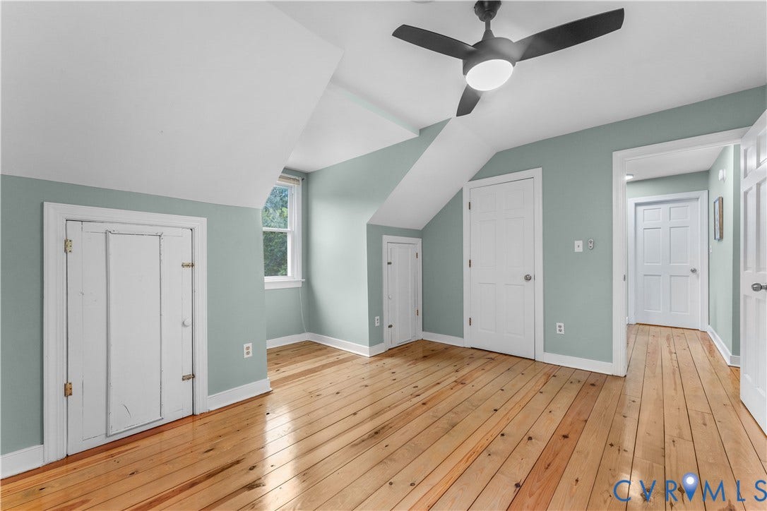3927 Hughes Creek Road, Powhatan, VA 23139 Sloping ceilings with a matte black ceiling fan, light wood plank flooring, and a single window
