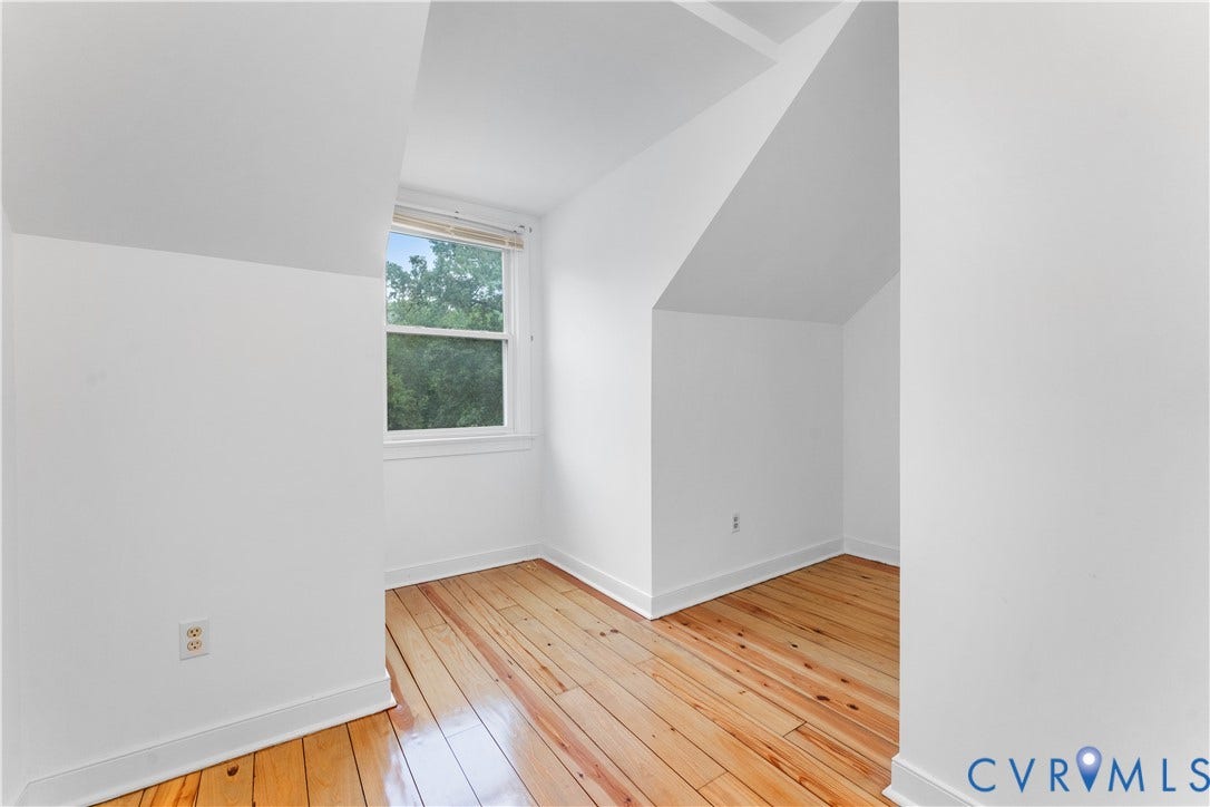 3927 Hughes Creek Road, Powhatan, VA 23139 Sloped ceilings, wood-finish flooring, white walls, and a double-hung window with a blind