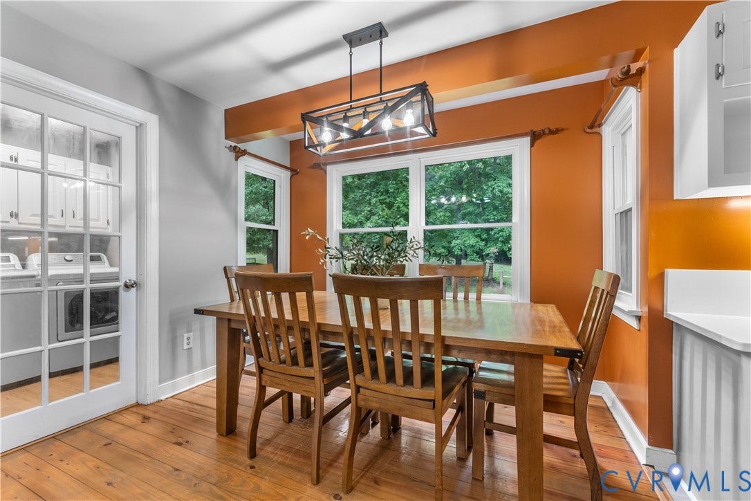 3927 Hughes Creek Road, Powhatan, VA 23139 Wood-finish flooring, white trim, and a framed light fixture