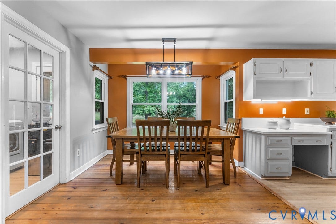 3927 Hughes Creek Road, Powhatan, VA 23139 Hardwood flooring, French doors, white cabinetry, integrated desk space, and a contemporary linear chandelier