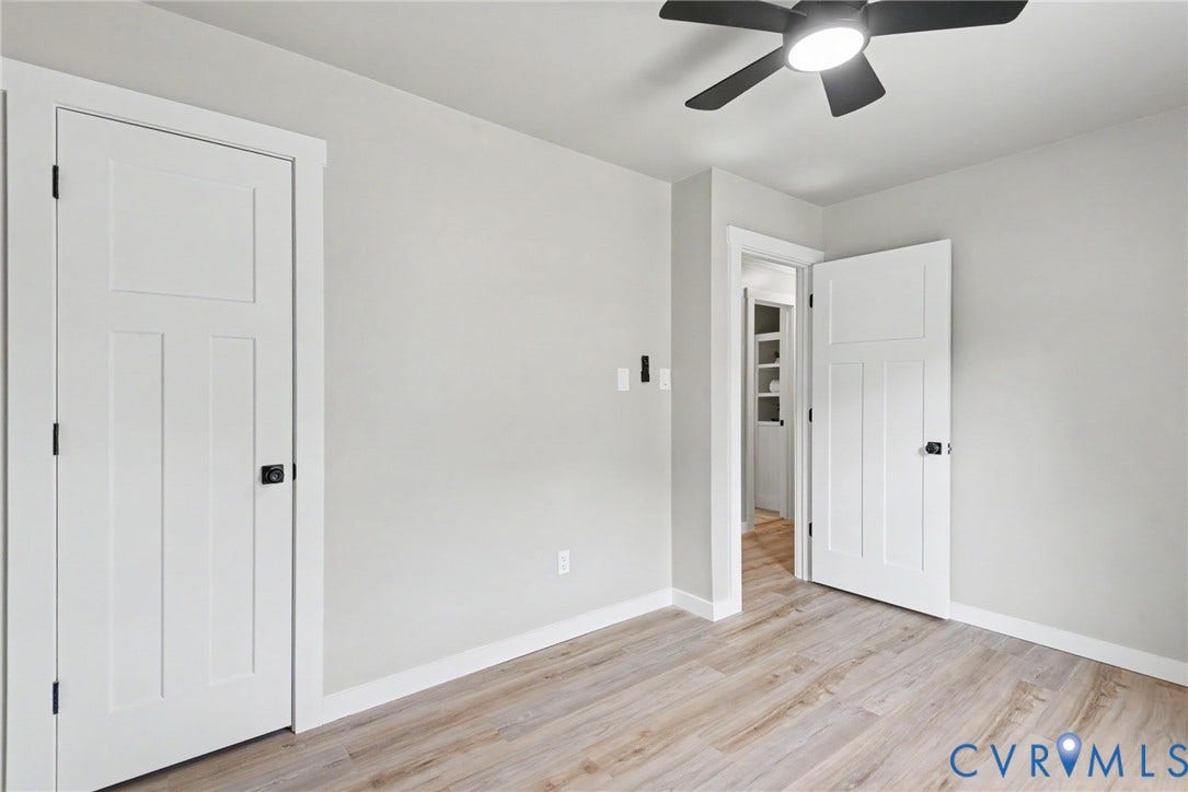 8906 Huntingcreek Place, Chesterfield, VA 23237 2nd bedroom featuring brand-new LVP flooring, New Ceiling fan/light with remote, and a closet. Recently updated with craftsman-style doors and trim.