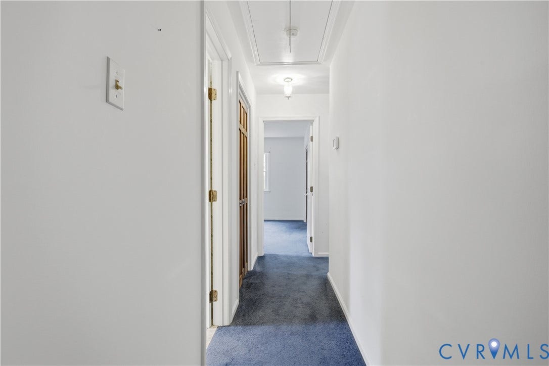 3641 Kiefer Road, Bermuda, Chester, VA 23831 Hallway featuring neutral-toned walls, blue carpeting, and white trim