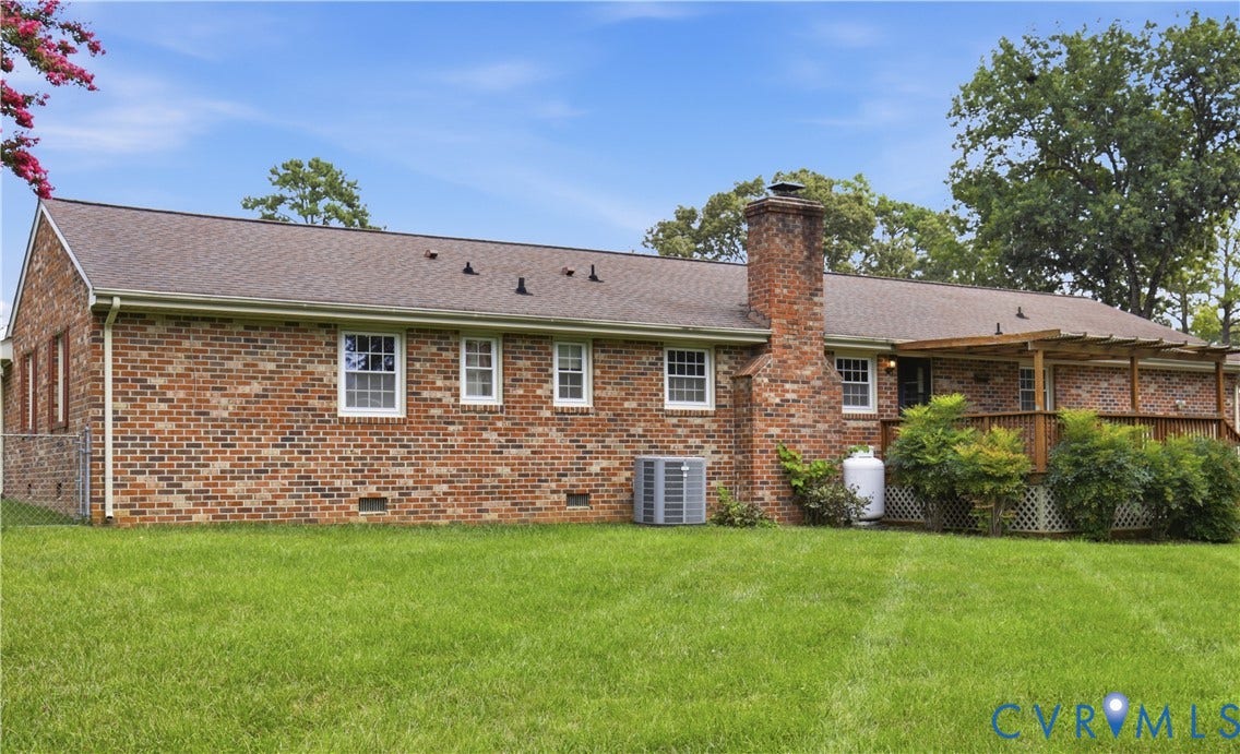 3641 Kiefer Road, Bermuda, Chester, VA 23831 Brick exterior featuring a wood deck with a pergola, a brick chimney, and a fenced side yard