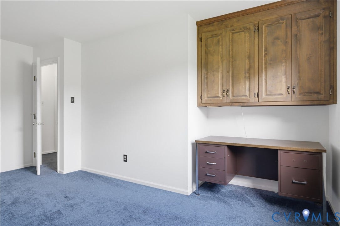 3641 Kiefer Road, Bermuda, Chester, VA 23831 Built-in wood-finish cabinetry positioned above a desk, featuring a metal frame and drawers