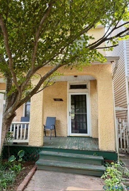 Exterior featuring a covered porch