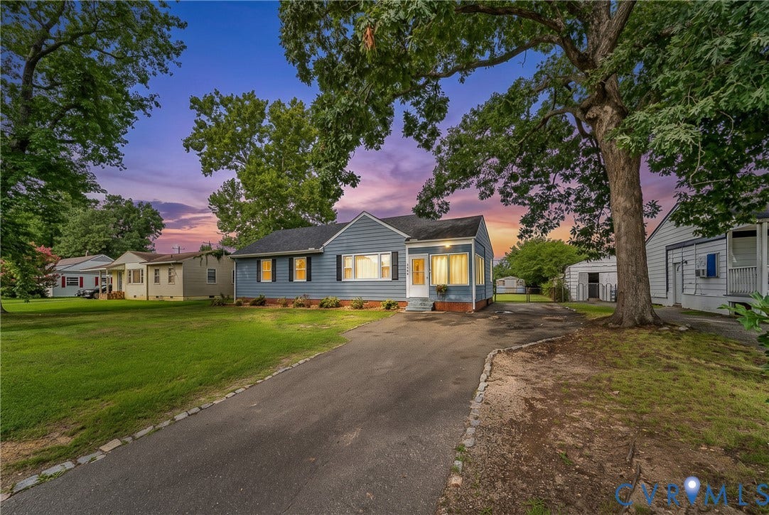 3304 Carlton Road, Henrico, VA 23223 Blue siding exterior with contrasting dark shutters, a front porch entry, and a paved driveway