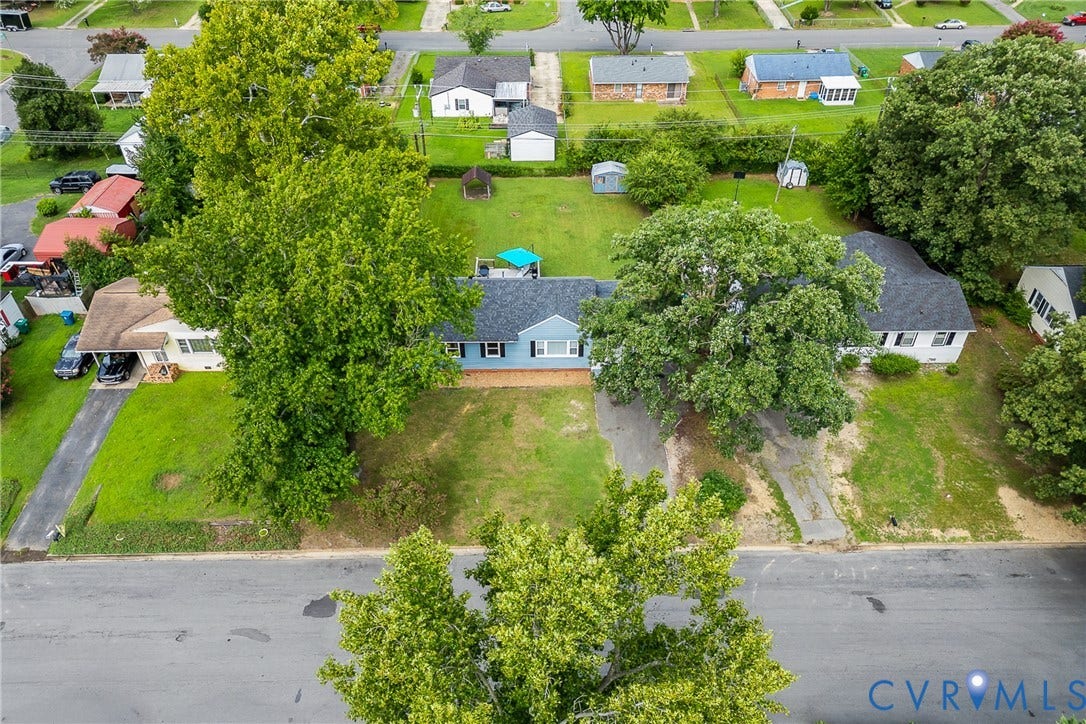 3304 Carlton Road, Henrico, VA 23223 Single-story residence featuring a gray shingle roof and light blue siding