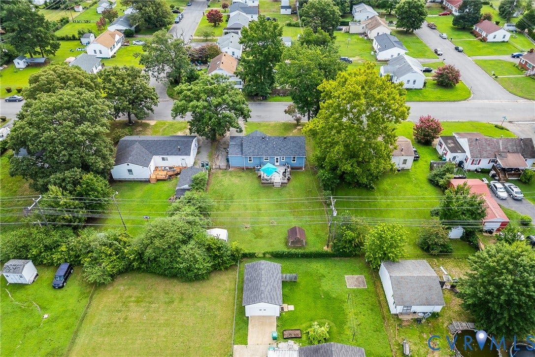 3304 Carlton Road, Henrico, VA 23223 Expansive residential lot featuring a light blue exterior, a dark shingle roof, and a wooden deck