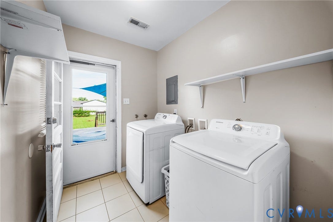 3304 Carlton Road, Henrico, VA 23223 Utility room featuring tiled flooring, a glass-paneled exterior door, and an overhead storage shelf