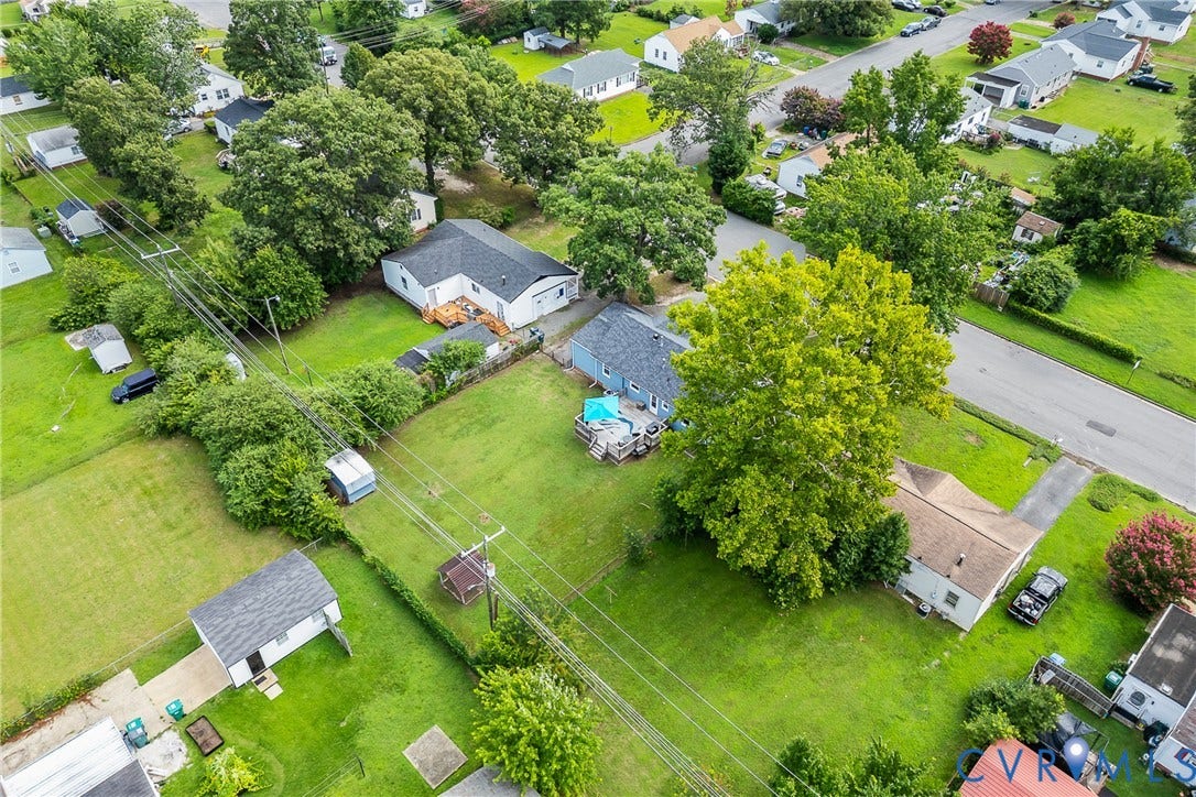 3304 Carlton Road, Henrico, VA 23223 Aerial view showcasing a residential neighborhood with multiple properties featuring expansive green lawns, mature trees, and detached single-story homes
