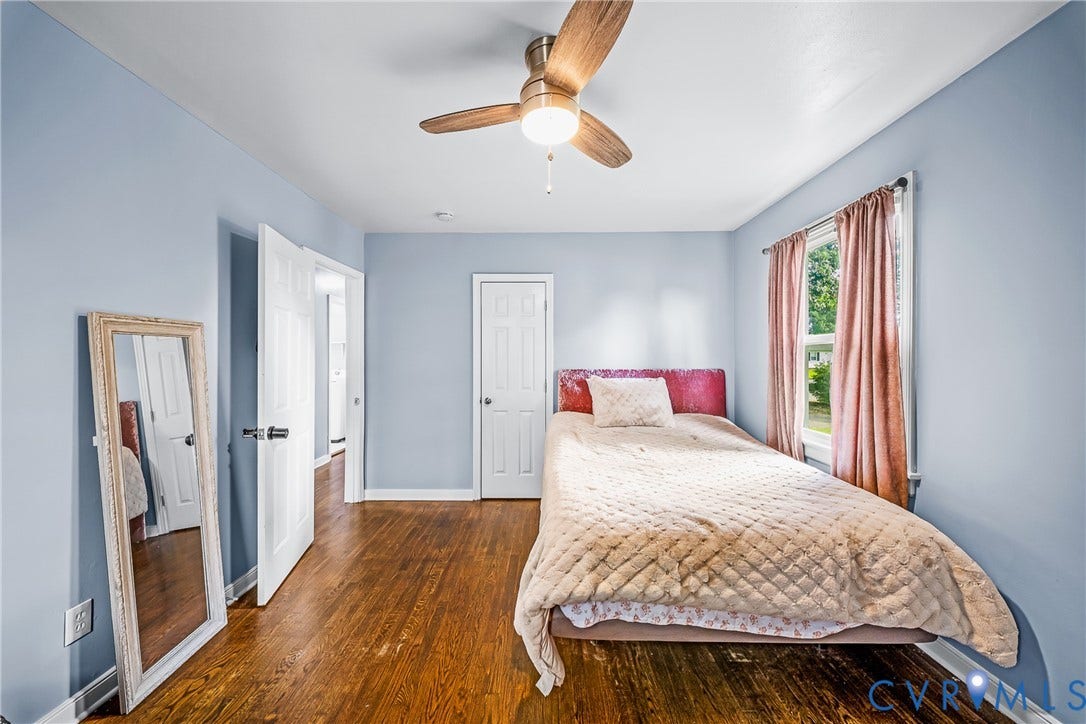 3304 Carlton Road, Henrico, VA 23223 Bedroom #1 featuring wood flooring, light blue walls, and a ceiling fan with integrated lighting