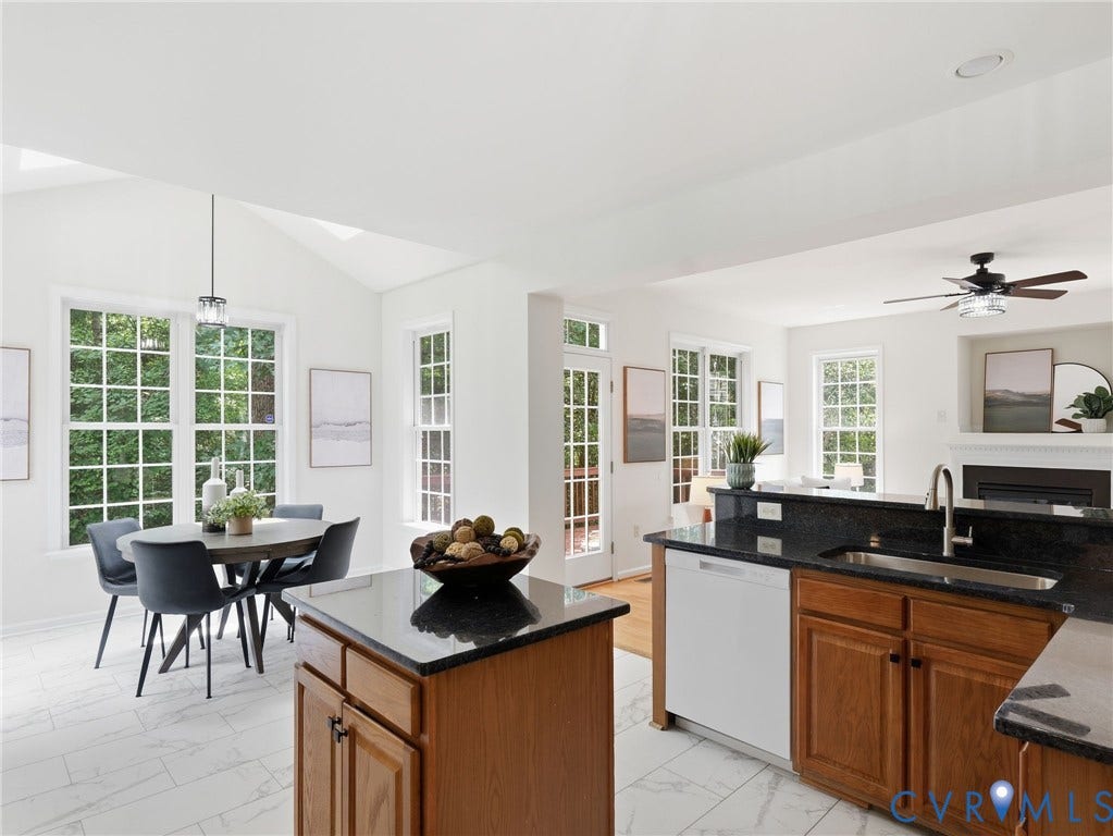 5707 Stephens Point Court, Chesterfield, VA 23831 Kitchen with center island looking onto Breakfast Nook area with skylights for ample natural light.