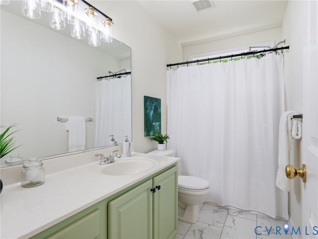 5707 Stephens Point Court, Chesterfield, VA 23831 Hall upstairs Bathroom featuring a light green vanity with dark hardware, a white countertop, updated flooring, freshly painted.