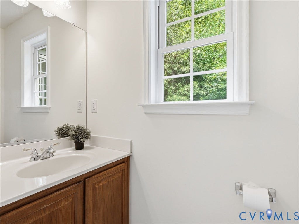 5707 Stephens Point Court, Chesterfield, VA 23831 Private Hall Half Bath with updated flooring and fresh paint.