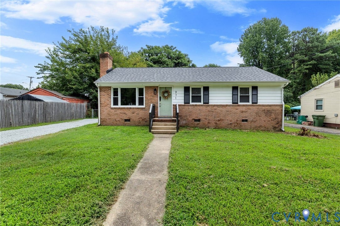 901 Kingsway Road, Woodhaven, Richmond, VA 23225 Brick and siding exterior with a composition shingle roof, featuring a concrete walkway, mature trees, and a gravel driveway