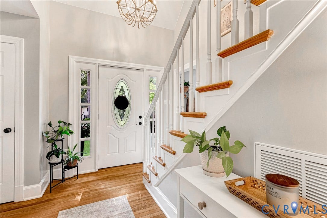 8800 Shewsbury Drive, New Kent, VA 23124 Entryway featuring a white paneled door with an oval stained-glass insert, flanked by sidelight windows