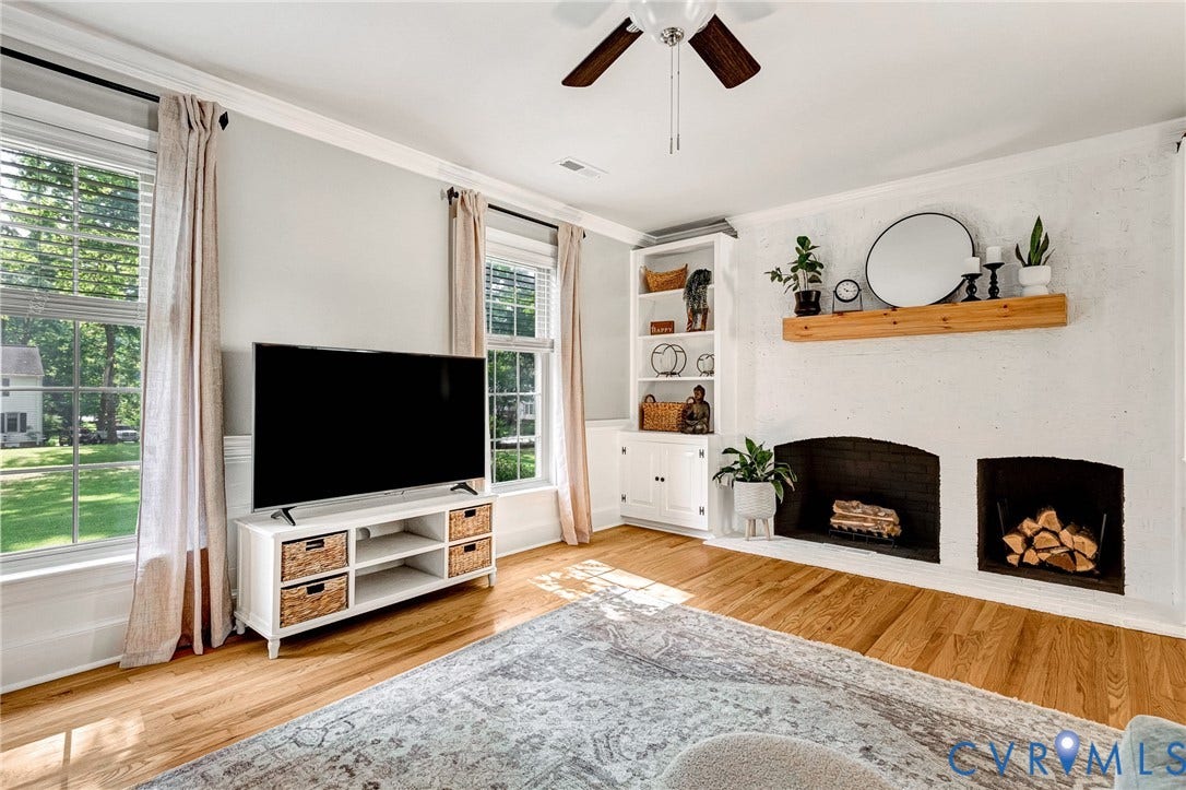 8800 Shewsbury Drive, New Kent, VA 23124 Living space with hardwood flooring, a ceiling fan, and multiple windows