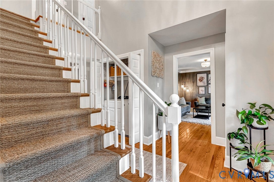 8800 Shewsbury Drive, New Kent, VA 23124 Staircase featuring carpeted treads, wood risers, and white balusters