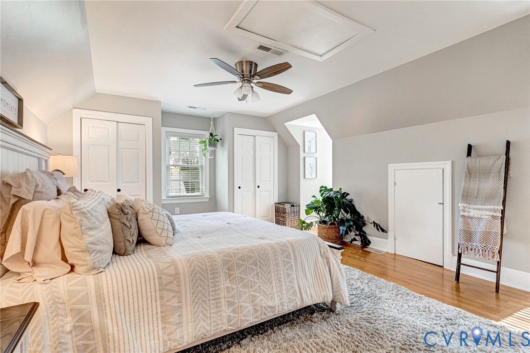8800 Shewsbury Drive, New Kent, VA 23124 Bedroom featuring wood-finish flooring, a ceiling fan with light fixture, and multiple windows