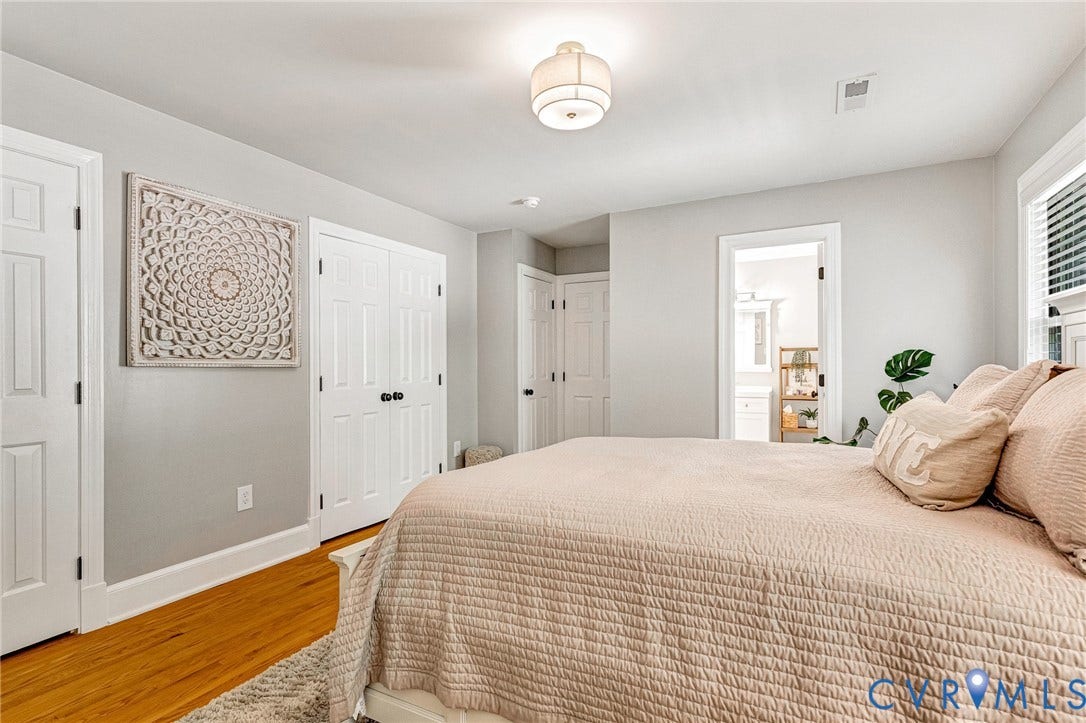 8800 Shewsbury Drive, New Kent, VA 23124 Hardwood-finish flooring featuring light gray walls, white trim, and a contemporary flush-mount ceiling light