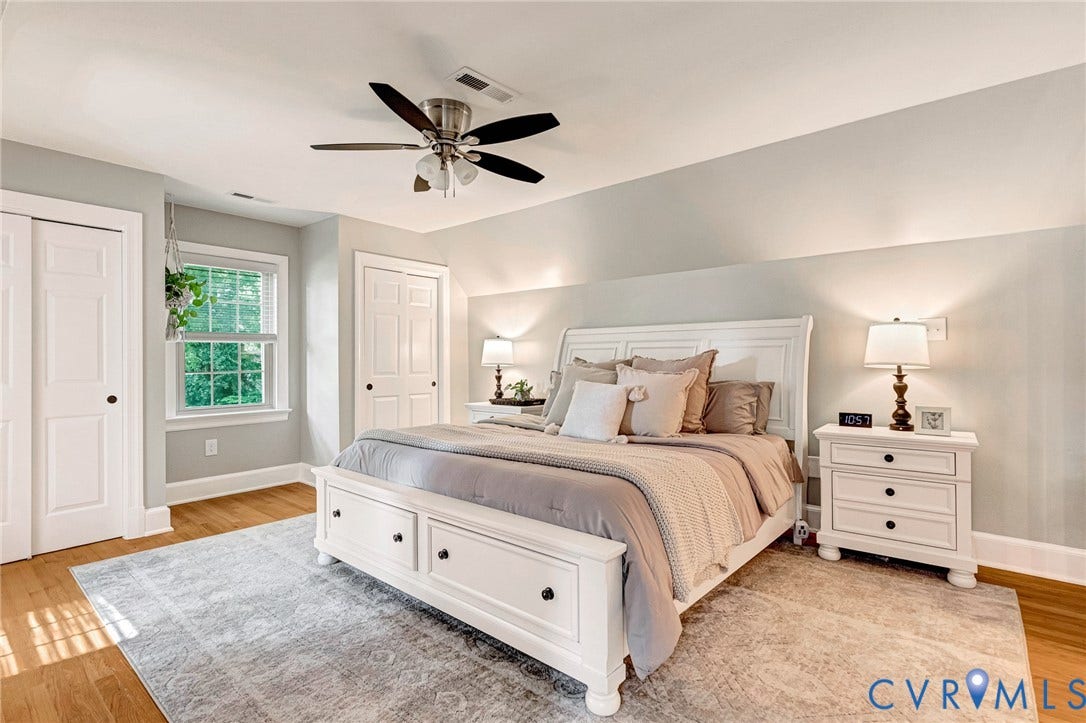 8800 Shewsbury Drive, New Kent, VA 23124 Spacious room featuring wood-finish flooring and a ceiling fan with integrated lighting