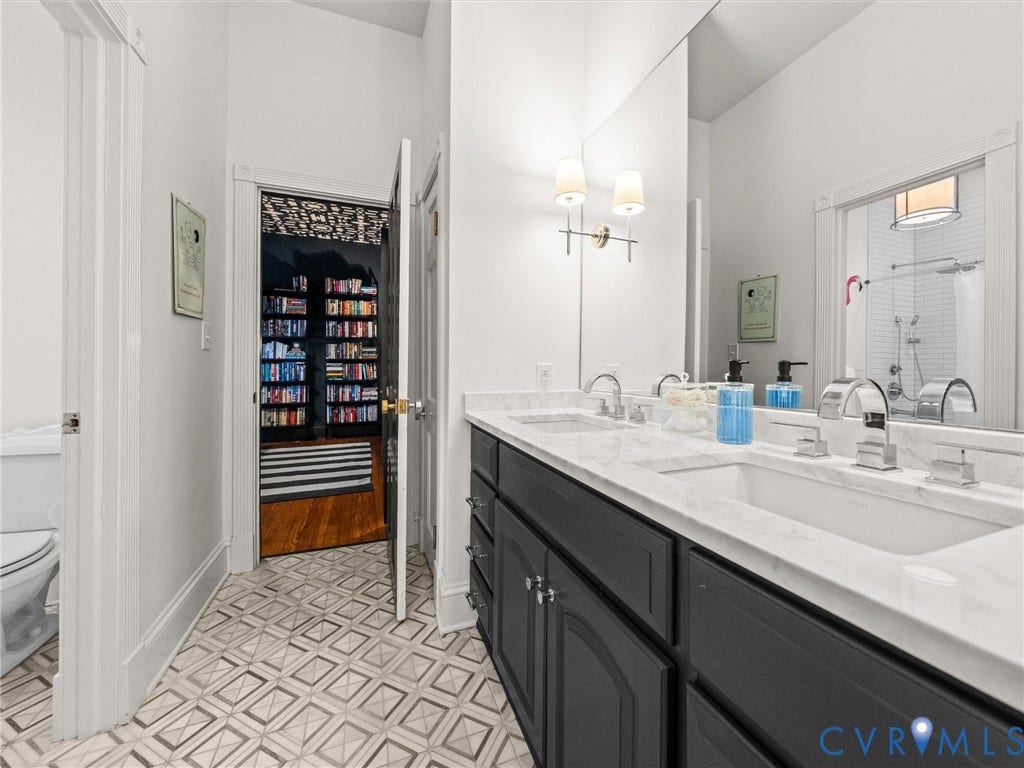 2242 Park Avenue, The Fan, Richmond, VA 23220 Jack-n-jill bathroom with Carrara marble double sink vanity.