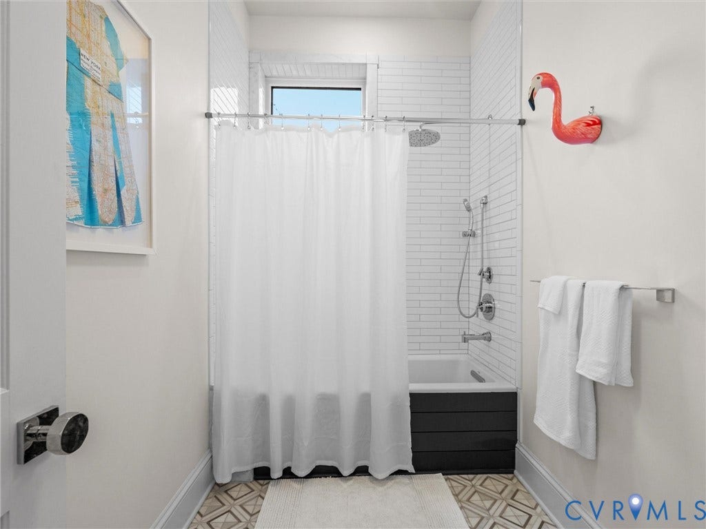 2242 Park Avenue, The Fan, Richmond, VA 23220 Bath has tub/shower combination, marble floors and shiplap sided tub.