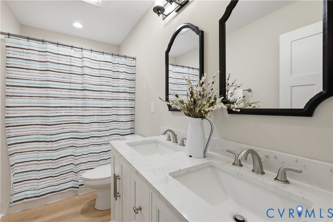 Dual vanity with integrated sinks and white countertops