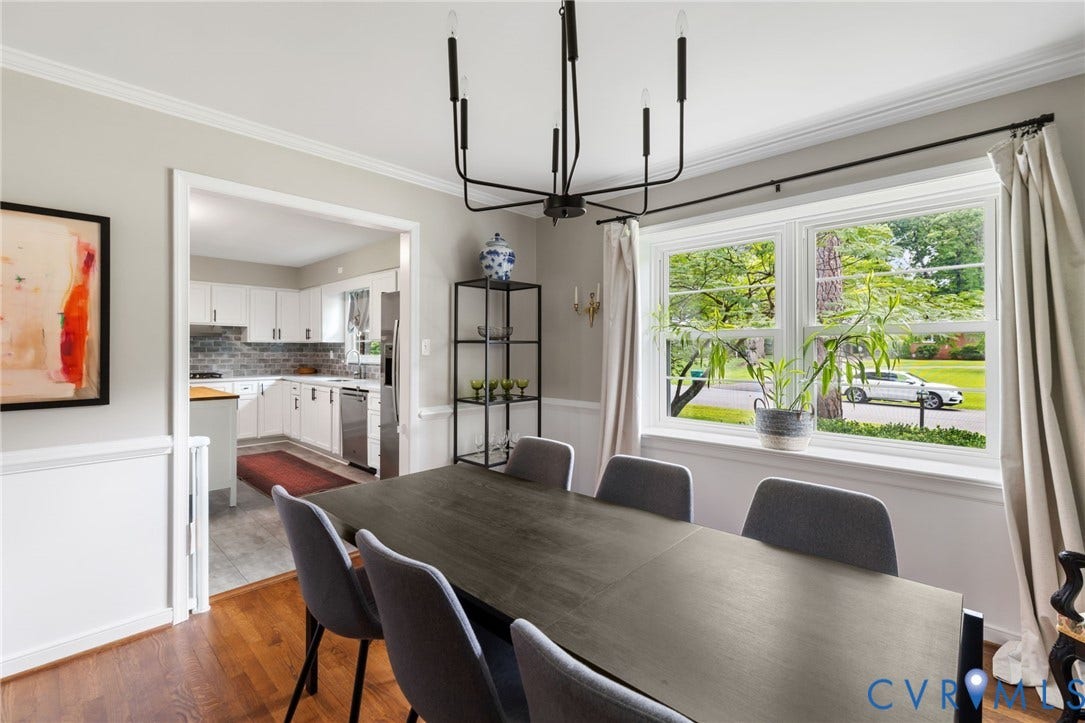 404 Aubery Road, Henrico, VA 23229 Dining area featuring refinished hardwood flooring and a contemporary black chandelier
