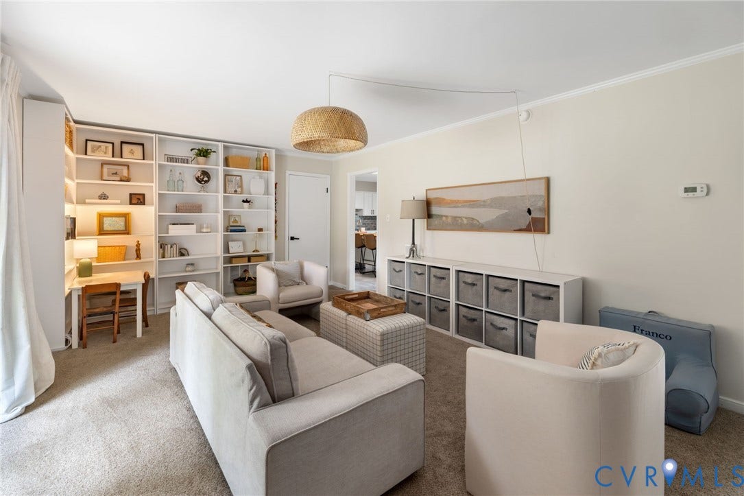 404 Aubery Road, Henrico, VA 23229 Living area featuring neutral wall tones, carpeted flooring, and crown molding
