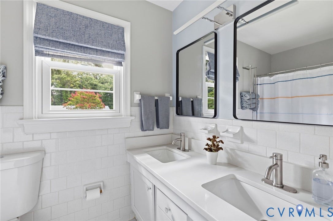 404 Aubery Road, Henrico, VA 23229 Bathtub/shower, dual sink vanity with integrated sinks, brushed nickel faucets, and white quartz countertops