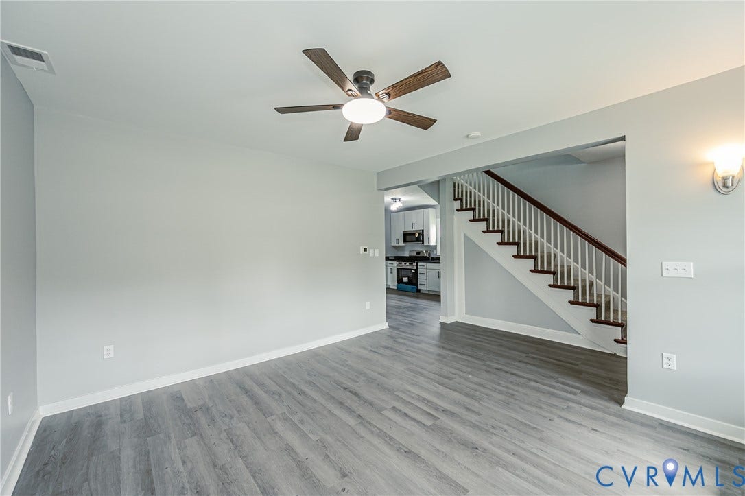 3903 Delmont Street, Henrico, VA 23222 Spacious living area featuring wood-finish flooring, a ceiling fan, and light gray walls