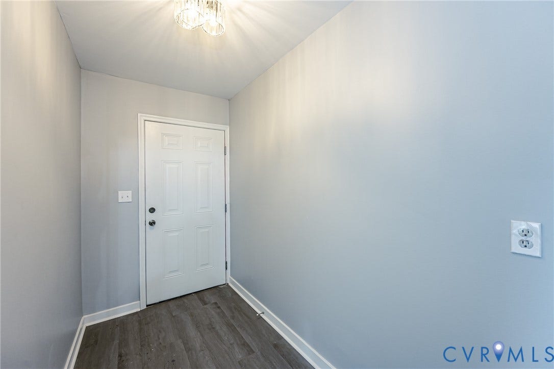 3903 Delmont Street, Henrico, VA 23222 Entryway with light gray walls, white trim, and wood-finish flooring