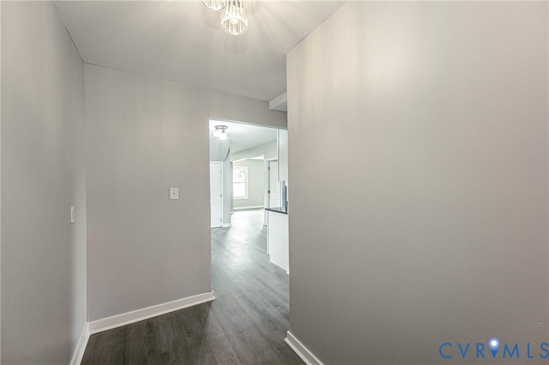 3903 Delmont Street, Henrico, VA 23222 Entryway with wood-finish flooring, white baseboards, and light gray walls