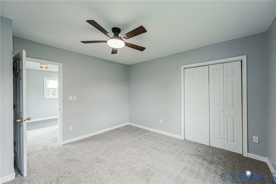 3903 Delmont Street, Henrico, VA 23222 Bright room featuring light grey wall paint and grey carpet flooring